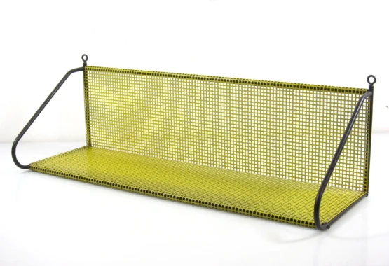 Handy fashion concious perforated 1950s vintage yellow bookshelf designed by Tjerk Rijenga for by Pilastro